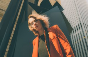 woman in orange blazer