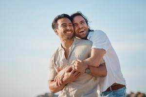 Couple holding each other on a sunny day